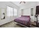 Bright bedroom featuring a built-in Murphy bed, soft carpet, and a mirrored wall to create depth at 4422 Mt Shavano St, Brighton, CO 80601