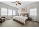 Bright bedroom featuring a neutral color palette, a large bed, and plenty of natural light at 4422 Mt Shavano St, Brighton, CO 80601