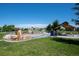 Neighborhood park featuring a playground, natural stone features, and picnic shelter for community gatherings at 4422 Mt Shavano St, Brighton, CO 80601