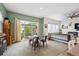 Inviting dining area with sliding glass doors to backyard, seamlessly connected to living area at 4422 Mt Shavano St, Brighton, CO 80601