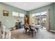 Bright dining area with sliding doors, contemporary decor, and ample seating at 4422 Mt Shavano St, Brighton, CO 80601