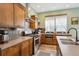 Charming kitchen featuring stainless steel appliances and lots of cabinet and counter space at 4422 Mt Shavano St, Brighton, CO 80601