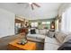 Open-concept living space featuring a modern kitchen, comfortable seating, and a bright, airy atmosphere at 4422 Mt Shavano St, Brighton, CO 80601