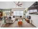 Spacious living room seamlessly connects with the kitchen and dining area, featuring modern decor and finishes at 4422 Mt Shavano St, Brighton, CO 80601