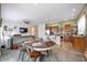Open-concept living space with kitchen, dining, and living areas for easy flow at 4422 Mt Shavano St, Brighton, CO 80601