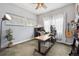 Home office with a standing desk, computer setup, and ample natural light at 4422 Mt Shavano St, Brighton, CO 80601