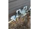 Exterior utility pipes and meter against siding with a lockbox in a residential area at 6378 S Hill St, Littleton, CO 80120