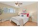 Cozy bedroom with a comfortable bed, natural light, and neutral decor at 7309 W Hampden Ave # 601, Lakewood, CO 80227