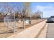 Community dog park with separate fenced areas for small and large dogs at 7309 W Hampden Ave # 601, Lakewood, CO 80227