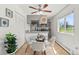 Bright and airy kitchen/dining area features a modern ceiling fan and natural light at 7309 W Hampden Ave # 601, Lakewood, CO 80227