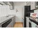 Spacious kitchen featuring stainless steel appliances, granite countertops, and tile flooring at 7309 W Hampden Ave # 601, Lakewood, CO 80227