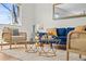 Well-appointed living room showcasing modern furniture, a stylish rug, and natural light at 7309 W Hampden Ave # 601, Lakewood, CO 80227
