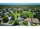Beautiful aerial view showcasing the property's location near a green park with mature trees and walking paths at 12651 E Bates Cir, Aurora, CO 80014