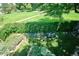 Lush backyard featuring privacy hedges, a rock garden, and green lawn create a peaceful retreat at 12651 E Bates Cir, Aurora, CO 80014