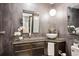 Modern bathroom with vessel sink, stone countertop and elegant lighting at 12651 E Bates Cir, Aurora, CO 80014