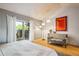Bedroom with sliding glass door leading to the backyard patio at 12651 E Bates Cir, Aurora, CO 80014