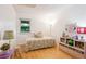 Bright ' bedroom with daybed, natural light and playful decor at 12651 E Bates Cir, Aurora, CO 80014
