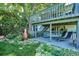 Multi-level deck offering lounge seating and garden views, providing a serene outdoor retreat at 12651 E Bates Cir, Aurora, CO 80014