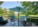 Charming deck with table, chairs, and a sun umbrella at 12651 E Bates Cir, Aurora, CO 80014