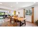 Open concept living area featuring a dining area, living room, and hardwood floors at 12651 E Bates Cir, Aurora, CO 80014
