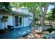 Back patio features sliding glass doors for easy indoor-outdoor flow, stylish furniture and potted plants at 12651 E Bates Cir, Aurora, CO 80014