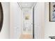 Hallway view showcasing a toilet and sink area at 1200 N Humboldt St # 1003, Denver, CO 80218