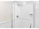 Modern bathroom featuring a glass-enclosed shower with white tile and sleek fixtures at 1200 N Humboldt St # 1003, Denver, CO 80218
