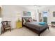 Bright bedroom offering ample natural light with a light grey bedspread, balcony access, and neutral walls at 1200 N Humboldt St # 1003, Denver, CO 80218
