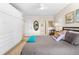 Bright bedroom featuring built-in wardrobes, neutral tones, and ceiling fan fixture at 1200 N Humboldt St # 1003, Denver, CO 80218
