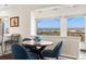 Bright breakfast nook with seating, a view of the skyline, and mountain views from the windows at 1200 N Humboldt St # 1003, Denver, CO 80218