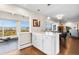Bright kitchen featuring an island, quartz countertops and wood flooring with city views at 1200 N Humboldt St # 1003, Denver, CO 80218