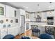 Modern kitchen with white cabinets, stainless steel appliances, and a stylish backsplash at 1200 N Humboldt St # 1003, Denver, CO 80218