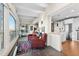 Cozy living room featuring two plush chairs, stone floors, and city views at 1200 N Humboldt St # 1003, Denver, CO 80218