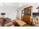 Cozy living room featuring a vintage hutch, comfortable seating, and hardwood floors at 1200 N Humboldt St # 1003, Denver, CO 80218