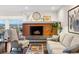 Warm living room with a fireplace, stylish furniture, and a view of the mountains at 1200 N Humboldt St # 1003, Denver, CO 80218