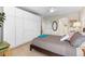 Comfortable bedroom featuring built-in closets and plenty of natural light at 1200 N Humboldt St # 1003, Denver, CO 80218