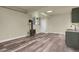 Finished basement with laminate flooring, a wood burning stove and modern sink at 586 Alpine Way, Idaho Springs, CO 80452
