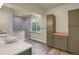 Bright bathroom with a glass shower, wood-look floors and ample cabinet space at 586 Alpine Way, Idaho Springs, CO 80452
