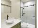 Bathroom featuring a modern vessel sink, walk-in shower with glass door, and sleek fixtures at 586 Alpine Way, Idaho Springs, CO 80452