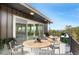 Inviting outdoor deck with modern furniture, offering stunning views at 586 Alpine Way, Idaho Springs, CO 80452