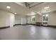 Spacious garage featuring multiple garage doors and ample space for vehicles or projects at 586 Alpine Way, Idaho Springs, CO 80452