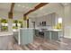 Bright kitchen with stainless steel appliances, light countertops, and wood beamed ceilings at 586 Alpine Way, Idaho Springs, CO 80452