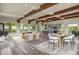 Spacious living room with hardwood floors, fireplace, and large windows showcasing the natural scenery at 586 Alpine Way, Idaho Springs, CO 80452