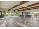 Spacious living room featuring wood beam ceilings, a wood burning stove, and bright windows at 586 Alpine Way, Idaho Springs, CO 80452