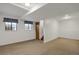 Partially finished basement with carpeted area and windows for natural light at 18206 E Tanforan Pl, Aurora, CO 80015