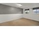 Finished basement featuring carpet, neutral colors, and natural light at 18206 E Tanforan Pl, Aurora, CO 80015