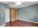 Bedroom with hardwood floors, ceiling fan, closet and natural light at 18206 E Tanforan Pl, Aurora, CO 80015