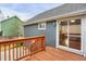 Backyard deck with wood railings, accessible through a sliding glass door, perfect for relaxation at 18206 E Tanforan Pl, Aurora, CO 80015