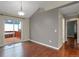 Dining area featuring wood floors, deck access, and neutral decor at 18206 E Tanforan Pl, Aurora, CO 80015