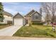 Charming home featuring a garage, brick accents, and well-maintained front yard at 18206 E Tanforan Pl, Aurora, CO 80015